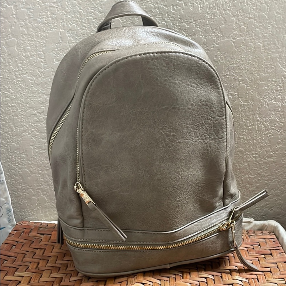Madison West Gray Backpack with Adjustable Straps and Minimalist Design